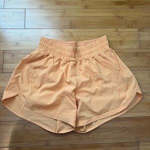 Lululemon orange shorts. Built in underwear. Size 6.